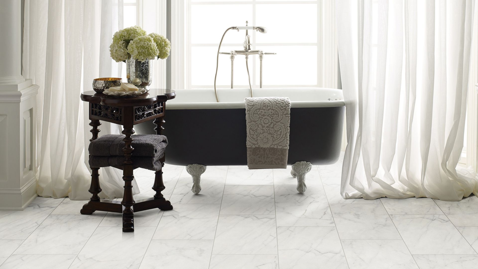 tile flooring in a bright white bathroom with a standalone tub